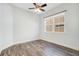 Bedroom featuring sleek hardwood floors and a ceiling fan at 2460 Promenade Dr, St Cloud, FL 34772