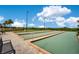 This community features well-maintained bocce ball courts with benches and palm trees for a relaxing game at 2460 Promenade Dr, St Cloud, FL 34772