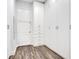 Walk-in closet features custom built-ins and hardwood floors at 2460 Promenade Dr, St Cloud, FL 34772