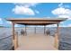 Community gazebo on the water with benches offers a tranquil space to relax and enjoy the view at 2460 Promenade Dr, St Cloud, FL 34772