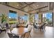 Bright dining area with large windows, stylish seating, and elegant decor, ideal for entertaining guests at 2460 Promenade Dr, St Cloud, FL 34772