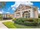 Beautiful single-Gathering home featuring manicured landscaping and a brick paved driveway at 2460 Promenade Dr, St Cloud, FL 34772