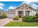 Charming single-Gathering home showcasing a well-manicured lawn and inviting brick pathway at 2460 Promenade Dr, St Cloud, FL 34772