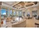Expansive lounge area with chic furnishings, high ceilings, and abundant natural light for relaxation at 2460 Promenade Dr, St Cloud, FL 34772