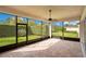 Relax in this screened lanai featuring a ceiling fan and brick pavers at 2460 Promenade Dr, St Cloud, FL 34772