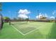 Well-maintained outdoor pickleball courts with vibrant surfaces, nets, and fencing for recreational play at 2460 Promenade Dr, St Cloud, FL 34772