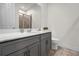 Bathroom with a large vanity and a shower behind a glass door at 2468 Varenna Loop, Kissimmee, FL 34741
