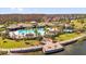 Resort-style community pool with lounge chairs, landscaping, and multiple buildings for recreation at 2468 Varenna Loop, Kissimmee, FL 34741