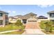 Inviting single-Gathering home with a manicured front yard and brick driveway, set in a Gathering-friendly neighborhood at 2468 Varenna Loop, Kissimmee, FL 34741