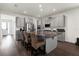 Spacious kitchen with a large island, granite countertops, and stainless steel appliances, perfect for entertaining at 2468 Varenna Loop, Kissimmee, FL 34741