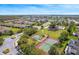 Community featuring tennis courts, a playground, and green spaces for an active lifestyle at 2814 Plymouth Pl, Kissimmee, FL 34741