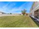 Expansive backyard featuring well-maintained lawn and a perimeter fence for privacy at 2814 Plymouth Pl, Kissimmee, FL 34741