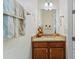 Powder room featuring a granite vanity top with a view into a neighboring room at 2814 Plymouth Pl, Kissimmee, FL 34741