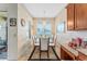 Elegant dining area filled with natural light, featuring a glass table with white chairs and stylish chandelier at 2814 Plymouth Pl, Kissimmee, FL 34741