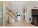 Grand entryway with ceramic tile flooring, a staircase, and views to the living room at 2814 Plymouth Pl, Kissimmee, FL 34741
