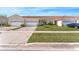 Attractive townhome featuring a well-maintained lawn and a convenient two-car garage at 2814 Plymouth Pl, Kissimmee, FL 34741