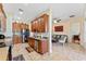 Open kitchen featuring stainless steel appliances, wood cabinets, and tile floors at 2814 Plymouth Pl, Kissimmee, FL 34741