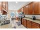 Well-appointed kitchen features stainless steel appliances, granite countertops, ample cabinetry, and adjacent dining area at 2814 Plymouth Pl, Kissimmee, FL 34741