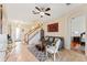 Open concept living room with tile floors, decorative staircase, and views to the bedrooms at 2814 Plymouth Pl, Kissimmee, FL 34741