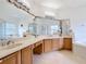 Bright bathroom features a spacious vanity with dual sinks, large mirror, jacuzzi and separate shower at 3010 Winding Trl, Kissimmee, FL 34746