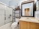 The bathroom has a shower and shelving at 3010 Winding Trl, Kissimmee, FL 34746