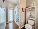 Bathroom featuring a shower with a decorative ocean-themed shower curtain and tiled floors at 3010 Winding Trl, Kissimmee, FL 34746