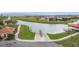 Aerial view of a community boat ramp with access to the lake, surrounded by residential homes at 3010 Winding Trl, Kissimmee, FL 34746