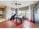 Inviting breakfast nook with large windows and elegant decor, adjacent to the kitchen and living area at 3010 Winding Trl, Kissimmee, FL 34746