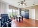 Inviting breakfast nook with large windows and elegant decor, adjacent to the kitchen and living area at 3010 Winding Trl, Kissimmee, FL 34746