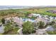 Resort-style community pool with lush landscaping, poolside seating, and elegant clubhouse at 3010 Winding Trl, Kissimmee, FL 34746