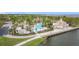 Resort-style community pool with lush landscaping, poolside seating, and elegant clubhouse at 3010 Winding Trl, Kissimmee, FL 34746