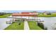Community dock featuring a covered area and walkways over the water for resident's enjoyment at 3010 Winding Trl, Kissimmee, FL 34746