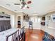 Open-concept kitchen seamlessly connects to the breakfast nook and features warm tones throughout the design at 3010 Winding Trl, Kissimmee, FL 34746