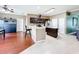 Open kitchen features stainless steel appliances, a breakfast bar, and seamless flow to the breakfast area at 3010 Winding Trl, Kissimmee, FL 34746