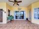 Lanai featuring brick flooring, ceiling fan, and view of the backyard at 3010 Winding Trl, Kissimmee, FL 34746