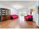 Bright living room featuring wood floors, archways and patio doors leading to the outdoor space at 3010 Winding Trl, Kissimmee, FL 34746