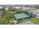 Community tennis and basketball courts with green fencing and a covered seating area at 3010 Winding Trl, Kissimmee, FL 34746