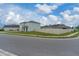 Corner lot showing the side and rear of the home with a fenced in yard at 3188 Serendipity Way, Davenport, FL 33896