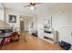 Bedroom with ceiling fan, mirrored closet doors, and dresser, offering ample storage and natural light at 3203 Rio Grande Trl, Kissimmee, FL 34741