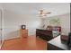 Bedroom with a window, ceiling fan, comfortable bed, and a closet at 3203 Rio Grande Trl, Kissimmee, FL 34741