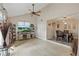 Spacious living room with vaulted ceiling and wood-look flooring, creating an open and airy atmosphere at 3203 Rio Grande Trl, Kissimmee, FL 34741