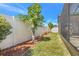Expansive backyard featuring vibrant lawn, privacy fence, and screened in patio at 3471 Julius Estates Blvd, Winter Haven, FL 33881