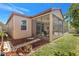 Relaxing screened lanai and serene backyard with lush landscaping and cozy seating area at 3471 Julius Estates Blvd, Winter Haven, FL 33881