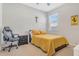Well-lit bedroom with a chair and nightstand at 3471 Julius Estates Blvd, Winter Haven, FL 33881