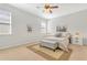 Bright bedroom with a ceiling fan, carpeted floors, and decoratively furnished with matching nightstands at 3471 Julius Estates Blvd, Winter Haven, FL 33881