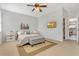 Beautiful bedroom with a ceiling fan and a flatscreen television mounted on the wall at 3471 Julius Estates Blvd, Winter Haven, FL 33881