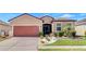 Charming single-story home featuring a well-maintained lawn and an attached two-car garage at 3471 Julius Estates Blvd, Winter Haven, FL 33881