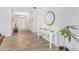 Bright hallway showcases wood-look tile floors and neutral paint at 3471 Julius Estates Blvd, Winter Haven, FL 33881