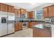 Well-equipped kitchen with stainless steel appliances, granite counters, and ample cabinet space at 3471 Julius Estates Blvd, Winter Haven, FL 33881