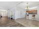 Spacious open floor plan with a view of the kitchen and dining area, and beautiful flooring at 3471 Julius Estates Blvd, Winter Haven, FL 33881